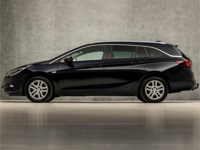 Opel ASTRA Sports Tourer 1.0 Sport (APPLE CARPLAY, GROOT NAVI, CLIMATE, TREKHAAK, SPORTSTOELEN, GETINT GLAS, PARKEERSENSOREN, NIEUWSTAAT)