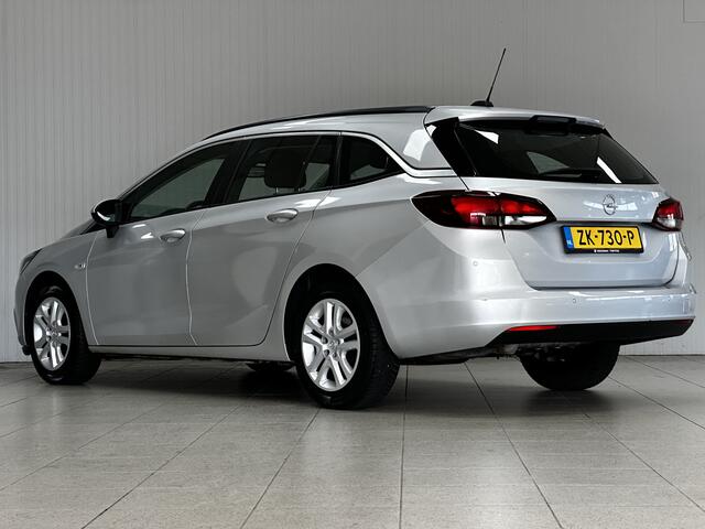 Opel ASTRA Sports Tourer 1.0 Turbo Business/ Apple + Android/ DAB+/ Navi/ Airco/ Cruise/ Elek. pakket/ Isofix/ Bluetooth/ Armsteun/ Multi. LEDER. Stuur/ PDC Achter.