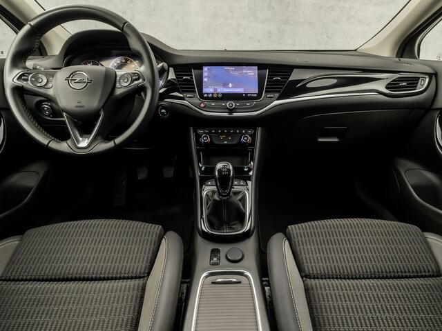 Opel ASTRA Sports Tourer 1.2 Elegance 146Pk (APPLE CARPLAY, GROOT NAVI, CLIMATE, CAMERA, LEDER, GETINT GLAS, SPORTSTOELEN, KEYLESS, LANE ASSIST, LED KOPLAMPEN, DAB+, LM VELGEN, NIEUWSTAAT)