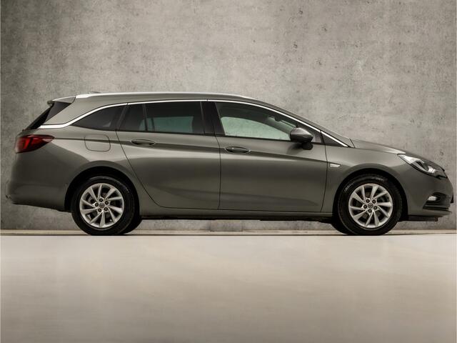 Opel ASTRA Sports Tourer 1.0 Innovation Sport (APPLE CARPLAY, GROOT NAVI, CLIMATE, LEDER, GETINT GLAS, SPORTSTOELEN, CAMERA, LM VELGEN, LED KOPLAMPEN, NIEUWSTAAT)