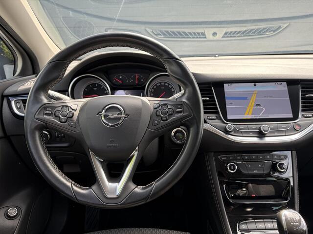 Opel ASTRA Sports Tourer 1.4 Innovation 2e Eigenaar,Navi,Camera,Trekhaak,150pk,Keyless,N.A.P,6 Bak,Pdc V+A,Halfleder,Clima,Cruise,Dodehoek,Lm velgen,Apk tot 03-2027