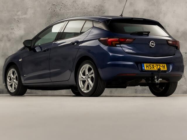 Opel ASTRA 1.2 Blitz Elegance 131Pk (APPLE CARPLAY, GROOT NAVI, ADAPTIVE CRUISE, CLIMATE, STUUR/STOELVERWARMING, SPORTSTOELEN, CAMERA, TREKHAAK, LEDER, GETINT GLAS, NIEUWSTAAT)