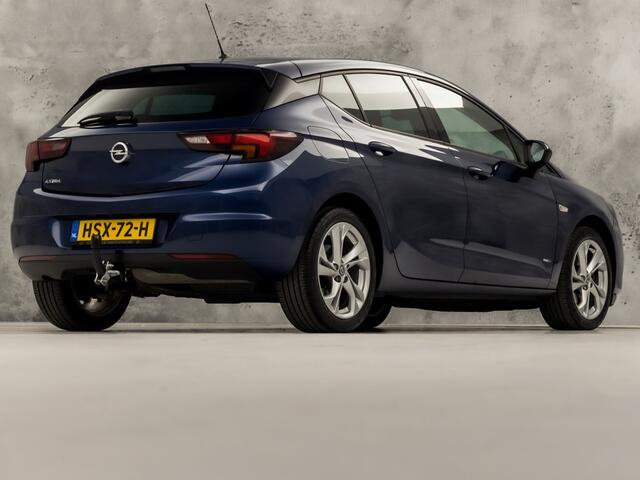 Opel ASTRA 1.2 Blitz Elegance 131Pk (APPLE CARPLAY, GROOT NAVI, ADAPTIVE CRUISE, CLIMATE, STUUR/STOELVERWARMING, SPORTSTOELEN, CAMERA, TREKHAAK, LEDER, GETINT GLAS, NIEUWSTAAT)