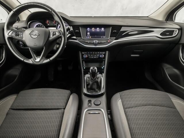 Opel ASTRA 1.2 Blitz Elegance 131Pk (APPLE CARPLAY, GROOT NAVI, ADAPTIVE CRUISE, CLIMATE, STUUR/STOELVERWARMING, SPORTSTOELEN, CAMERA, TREKHAAK, LEDER, GETINT GLAS, NIEUWSTAAT)