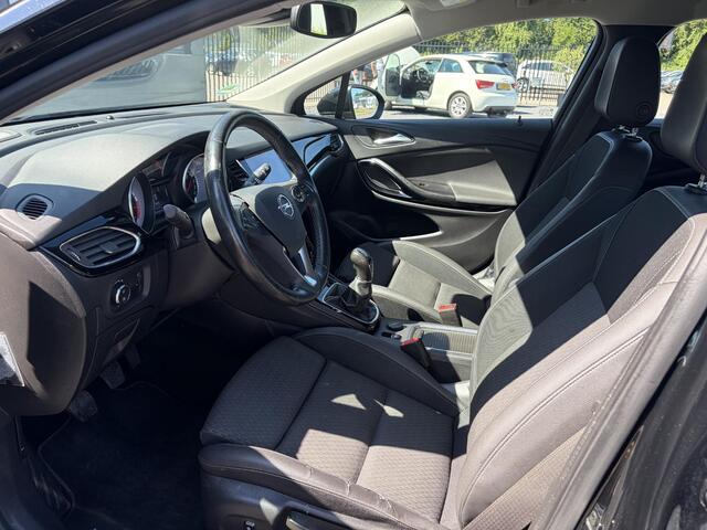 Opel ASTRA Sports Tourer 1.4 Business Executive 2e Eigenaar l 150pk l Carplay l Navi l Pdc V+A l Stoelvw-Stuurverw l Clima l Cruise l 18''Lmv l Halfleder l 6 Bak l Rijstrooksensor l N.A.P l Apk tot 08-2027