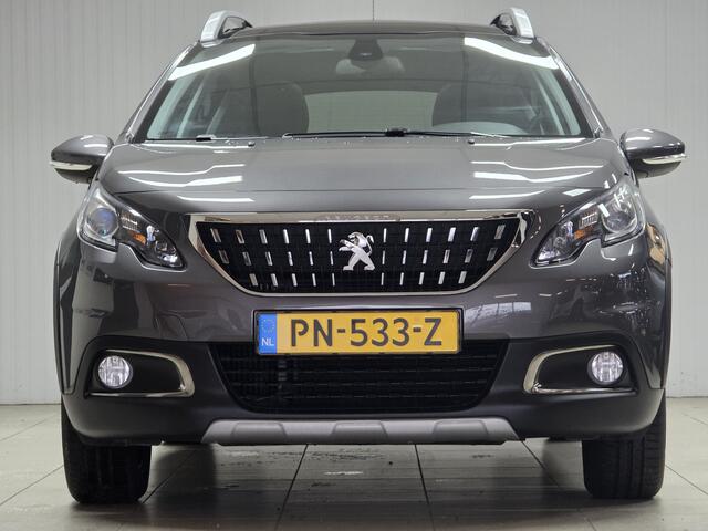 Peugeot 2008 1.2 PureTech Allure/ D-Riem verv: 64.000 KM!/ AUTOMAAT!/ Trekhaak/ Half-Leder/ Panorama-Dak/ Apple + Android/ DAB+/ Navi/ Clima/ Cruise/ Bluetooth/ Multi. LEDER. Stuur/ 16'' LMV/ Mistl./ PDC/ Extra getint Glas/ D