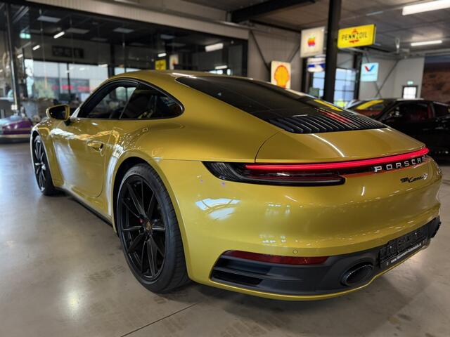 Porsche 992 911 3.0 Carrera S / 450 PK / Paint to Sample / PTS Yellow Storm / BOSE / Race-Tex / Alcantara / ACC / Sportuitlaat