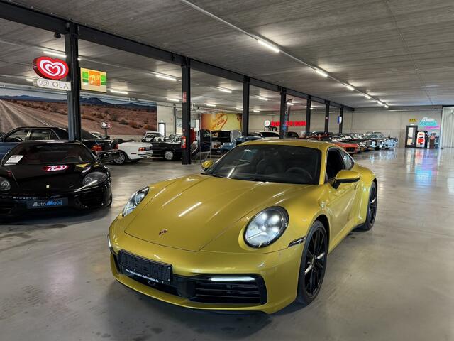 Porsche 992 911 3.0 Carrera S / 450 PK / Paint to Sample / PTS Yellow Storm / BOSE / Race-Tex / Alcantara / ACC / Sportuitlaat