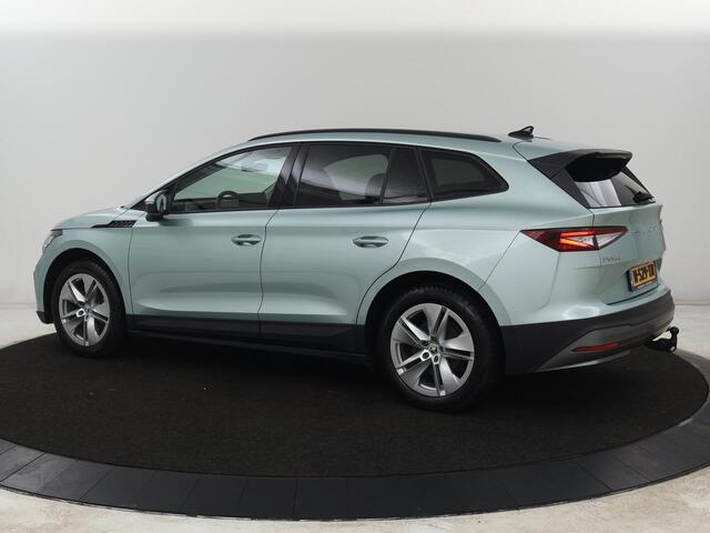 Skoda Enyaq iV 60 | SOH 91% | Trekhaak | Stoelverwarming | Camera | Sportstuur | Carplay | Navigatie | Cruise control | Full LED | Half leder | DAB | Parkeerhulp | Sfeerverlichting | Climate control