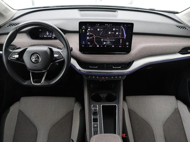 Skoda Enyaq iV 60 | SOH 91% | Trekhaak | Stoelverwarming | Camera | Sportstuur | Carplay | Navigatie | Cruise control | Full LED | Half leder | DAB | Parkeerhulp | Sfeerverlichting | Climate control