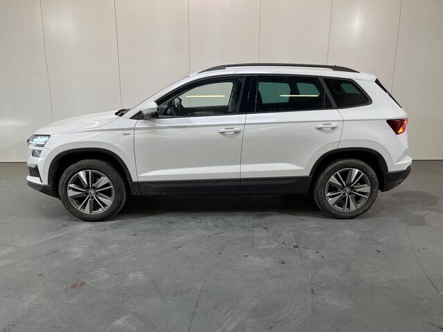 Skoda Karoq 1.0 TSI Ambition / ELEKTR. TREKHAAK/ KEYLESS/ SMARTLINK/ PARK. SENSOREN + CAMERA/ NAVI/ SPRAAKBEDIENING/ CLIMA/ STOEL-STUUR VERWARM.