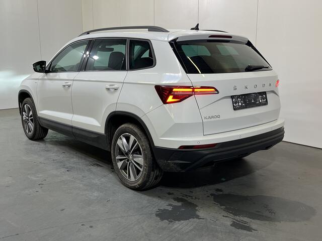 Skoda Karoq 1.0 TSI Ambition / ELEKTR. TREKHAAK/ KEYLESS/ SMARTLINK/ PARK. SENSOREN + CAMERA/ NAVI/ SPRAAKBEDIENING/ CLIMA/ STOEL-STUUR VERWARM.