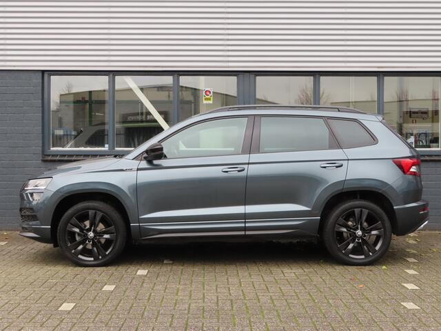Skoda Karoq 1.5 TSI ACT Sportline Business DSG | trekhaak wegklapbaar | stoel + stuurwielverwarming | camera | elektrische achterklep