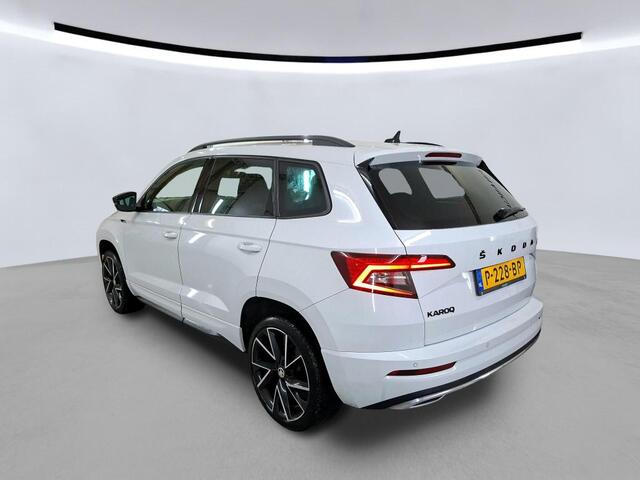 Skoda Karoq 1.5 TSI ACT Sportline Business Panorama Camera Stoel/Stuurverwarming Canton Sound Ozon en 1x velg miss Kofferklep schuren