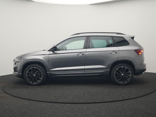 Skoda Karoq 1.5 TSI ACT Sportline Business DSG 150pk | Adaptive Cruise | Camera | Matrix LED | RS Sportstoelen Verwarmd | 18"L.M | Adaptive Onderstel | Keyless | Sfeerverlichting | Apple Carplay | Virtual | Navigatie | DAB |
