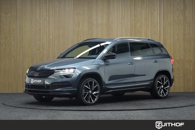 Skoda Karoq 1.5 TSI ACT Sportline Business DSG | Adaptive-cruise | Trekhaak | Camera | Clima | Stuur & Stoelverwarming | Navigatie | Virtual-Cockpit | Apple Carplay & Android Auto | Elek. Achterklep | Keyless | Dodehoekdetectie