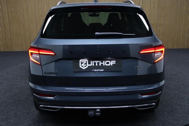 Skoda Karoq 1.5 TSI ACT Sportline Business DSG | Adaptive-cruise | Trekhaak | Camera | Clima | Stuur & Stoelverwarming | Navigatie | Virtual-Cockpit | Apple Carplay & Android Auto | Elek. Achterklep | Keyless | Dodehoekdetectie