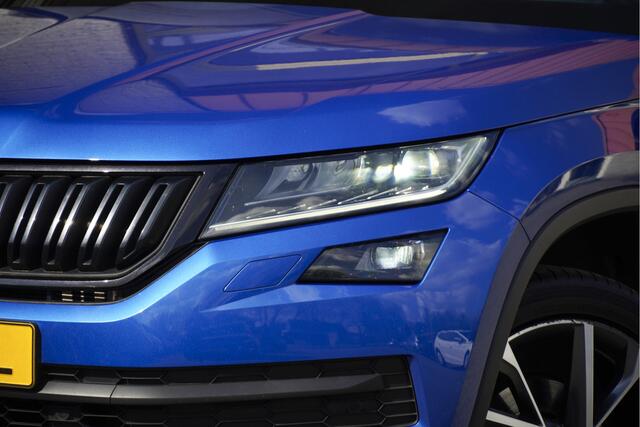 Skoda Kodiaq 1.5 TSI 150PK! Automaat Sportline Business BJ2020 Lmv 20" | Led V+A | Pdc | Keyless entry | Trekhaak afneembaar | Elek. achterklep | Achteruitrijcamera | App-Connect | Navi | Virtual cockpit | Dashboard verlichting | Sportstoelen/Sportstuur | Zwarte hemel