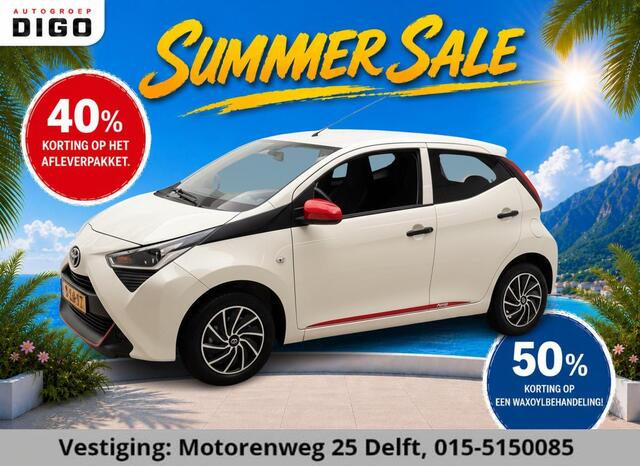 Toyota AYGO 1.0 VVT-i CORAL RED PACK 1e EIG. GARANTIE 7-2030* AIRCO. CARPLAY NAVI.PRIVACY GLASS. COMFORT PACK.100% OH