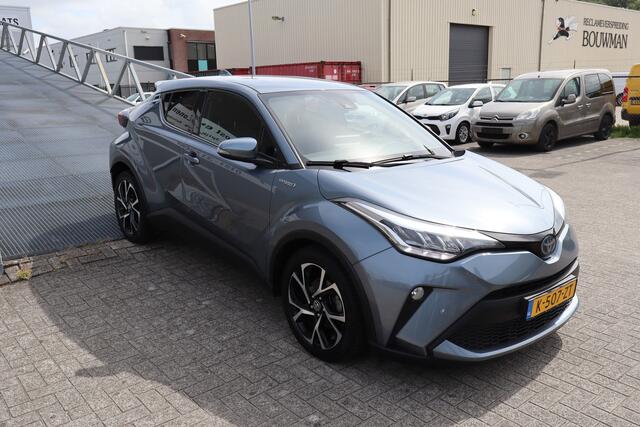 Toyota C-HR 1.8 Hybrid Business Plus Stoelverwarming/Achteruitrijcamera/JBL Audio/Navigatie/DAB/Bluetooth/Climate control/18 inch Licht metaal 2E PINKSTERDAG GEOPEND VAN 12:00 TOT 17:00 (ROTTERDAM&HELLEVOETSLUIS)