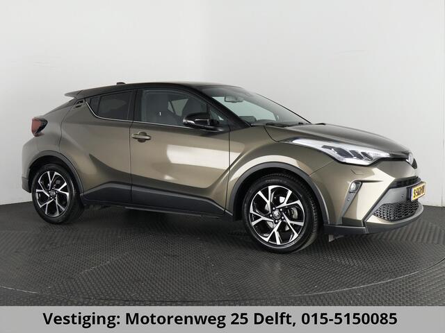 Toyota C-HR 1.8 HYBRID BI-TONE LUXERY LINE GARANTIE 5-2032 TREKHAAK. 4 SEIZOENEN BANDEN.NAVIGATIE. STUUR EN STOELVERWARMING. HALF LEDER