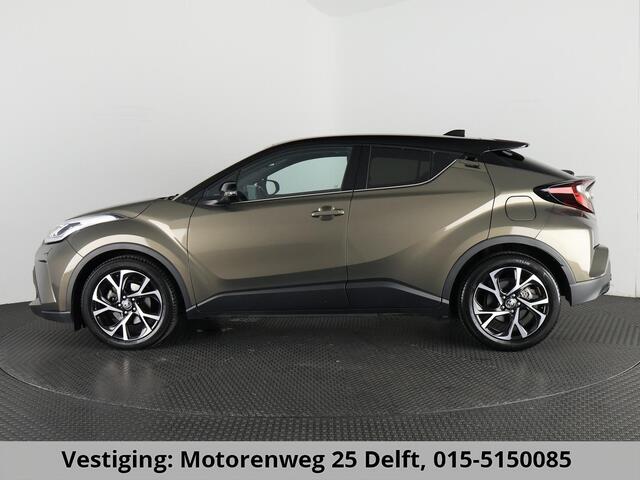 Toyota C-HR 1.8 HYBRID BI-TONE LUXERY LINE GARANTIE 5-2032 TREKHAAK. 4 SEIZOENEN BANDEN.NAVIGATIE. STUUR EN STOELVERWARMING. HALF LEDER