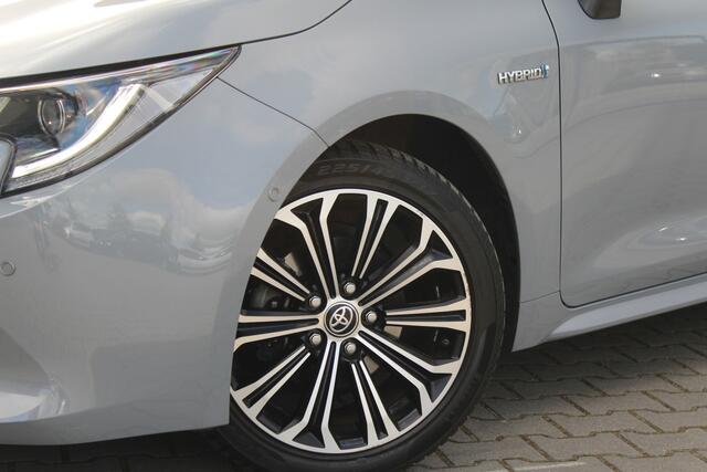 Toyota COROLLA Touring Sports 1.8 Hybrid Executive | incl. 12 maanden garantie | Dodehoek detectie | Camera | Stoelverwarming | Navigatie | Sportstoelen | Zwarte hemel | LED | DAB+ | Draadloze telefoonlader | Climate control | 17" lmv | Parkeersensoren V+A | Head up dis