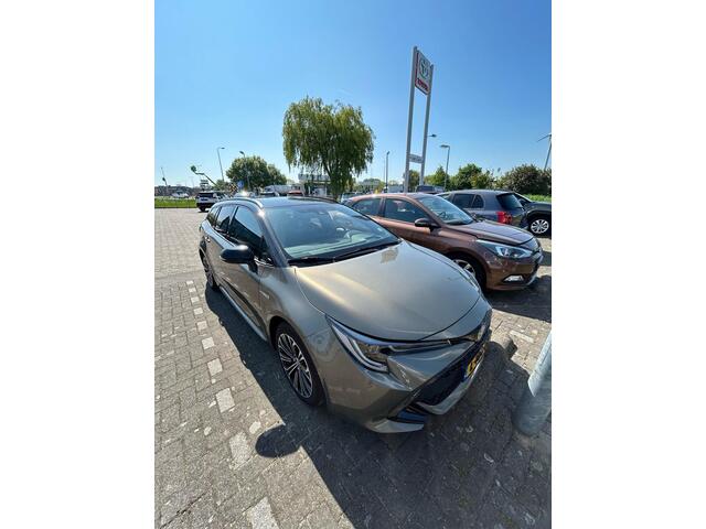 Toyota COROLLA Touring Sports 1.8 Hybrid Bi-Tone Limited, Trekhaak, HUD, Stoelverwarming, Apple carplay, Android Auto, Dealer onderhouden!