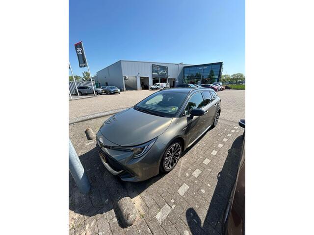 Toyota COROLLA Touring Sports 1.8 Hybrid Bi-Tone Limited, Trekhaak, HUD, Stoelverwarming, Apple carplay, Android Auto, Dealer onderhouden!