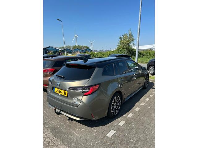 Toyota COROLLA Touring Sports 1.8 Hybrid Bi-Tone Limited, Trekhaak, HUD, Stoelverwarming, Apple carplay, Android Auto, Dealer onderhouden!