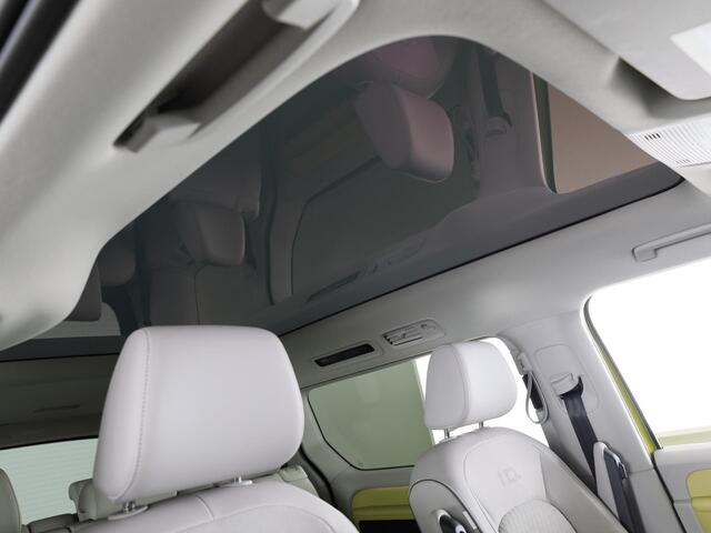 Volkswagen ID. Buzz Pro 86 kWh LWB 7p. 286 pk | SoH 96,36% |Navigatie | Panoramadak | Trekhaak (wegklapbaar) | Parkeersensoren (Park assist) | Rondomzicht camera | Elektr. schuifdeuren | Stoelverwarming |