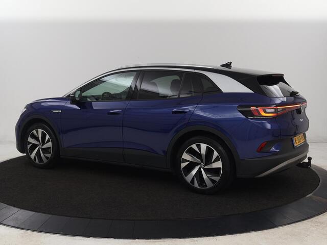 Volkswagen ID.4 First 77 kWh | Trekhaak | Stoel & stuurverwarming | Adaptive cruise | Camera | Carplay | Half leder | Navigatie | 20'' | Full LED | Keyless | Climate control | Sfeerverlichting