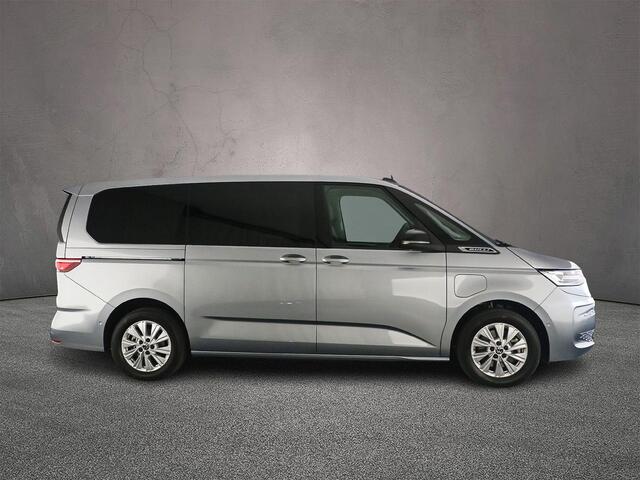 Volkswagen MULTIVAN 1.5 eHybrid L2 4Motion | incl. BTW/BPM ! | 7-zits | IQ Matrix LED Koplampen | Wegklapbare trekhaak | Travel Assist | Elec. achterklep | Multifunctionele tafel | Stoelverwarming