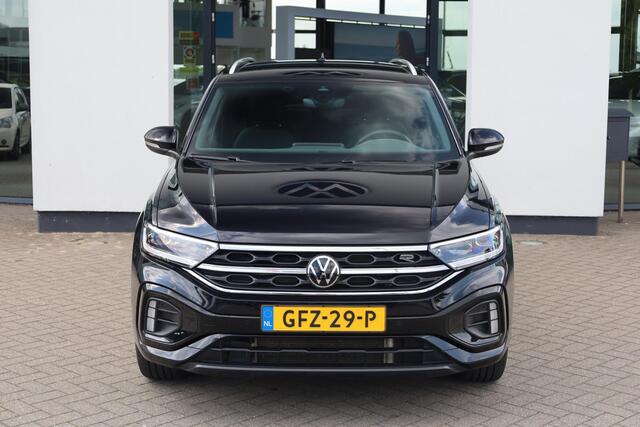 Volkswagen T-Roc 1.5 TSI R-Line Achteruitrijcamera trekhaak afneembaar privacy glas alarm ergo stoelen met leder alcantara stoel en stuurwiel verwarming ACC park assist navigatie 17" LMV valencia spiegel pakket