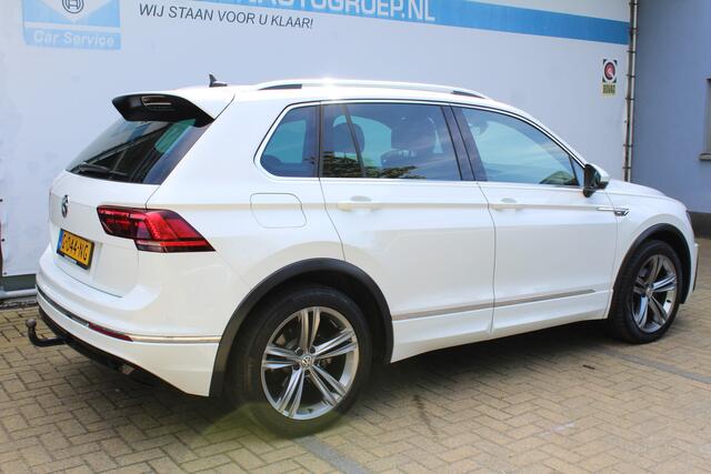 Volkswagen TIGUAN 1.5 TSI Comfortline Business R-Line | Incl. 12 maanden Garantie | Panorama dak | Stoelmassage | Virtual cockpit | Schuif/kantel dak | Stoelverwarming | Keyless entry/start | Elektrische kofferklep | Trekhaak | Parkeersensoren V+A | Climate controle | Navi
