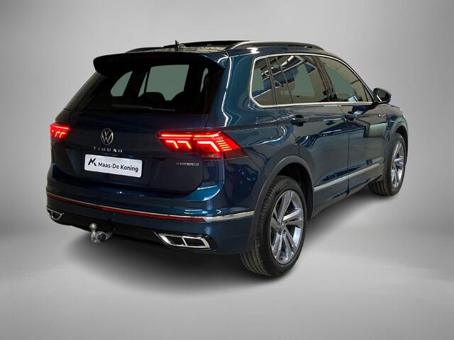 Volkswagen TIGUAN 1.4TSIeHybrid 180kW/245PK R-Line DSG · Panoramadak · Trekhaak · 360°Camera + Parkeersensoren · Garantie t/m 19-06-2026 of 60000km.