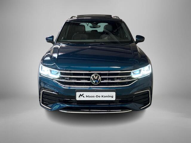 Volkswagen TIGUAN 1.4TSIeHybrid 180kW/245PK R-Line DSG · Panoramadak · Trekhaak · 360°Camera + Parkeersensoren · Garantie t/m 19-06-2026 of 60000km.