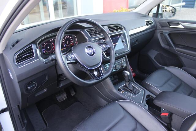 Volkswagen TIGUAN 1.5 TSI 150PK AUTOMAAT HIGHLINE BUSINESS R | PANORAMA SCHUIF/KANTEL DAK | LEDEREN BEKLEDING | BESTUUDERSSTOEL ELEKTRISCH VERSTELBAAR MET GEHEUGENFUNCTIE | ELEKTRISCH WEGKLAPBARE TREKHAAK | IQ LIGHT KOPLAMPEN | VIRTUAL DISPLAY | DRAADLOZE APPLE CARPLAY/ANDROID AUTO | NAVIGATIE | 19" LICHTMETALEN VELGEN | ELEKTRISCH BEDIENBARE ACHTERKLEP | GETINTE ACHTERRUITEN | CAMERA VOOR + ACHTER | PARKEERSENSOREN VOOR + ACHTER | STOEL VERWARMING |