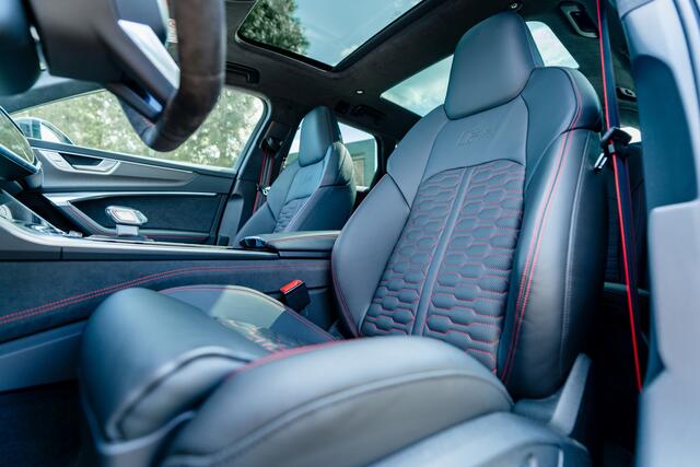 Audi RS6 Avant 4.0 TFSI ABT ABT HR22 Glossy Black | Audi Exclusive | Carbon optiek | Dynamic plus | Keramische remmen | Design pakket rood | Alcantara hemel | Panorama dak | Assistentiepakket plus B&O Premium audio | Carbon spiegels | Carnon interieur | HD Matrix 