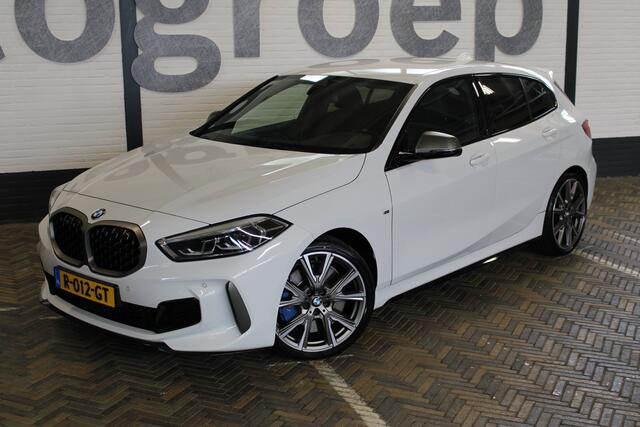 BMW 1-SERIE M135i xDrive High Executive | Akrapovic uitlaatsysteem | Cruise control | Climate control | Stoelverwarming | Apple carplay/Android auto | DAB radio | Dealer onderhouden |