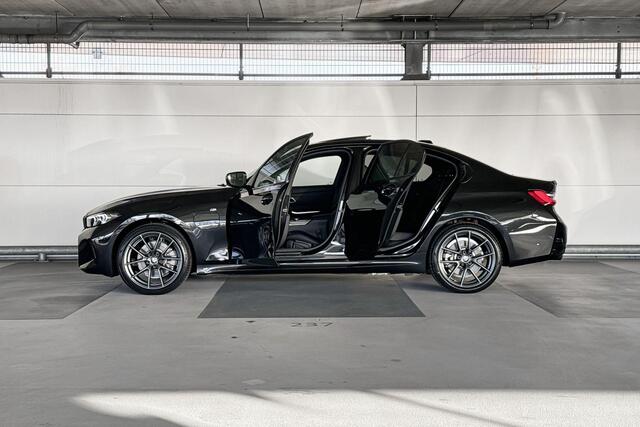 BMW 3-SERIE Touring 320e | M Sportpakket | Trekhaak met elektrisch wegklapbare kogel