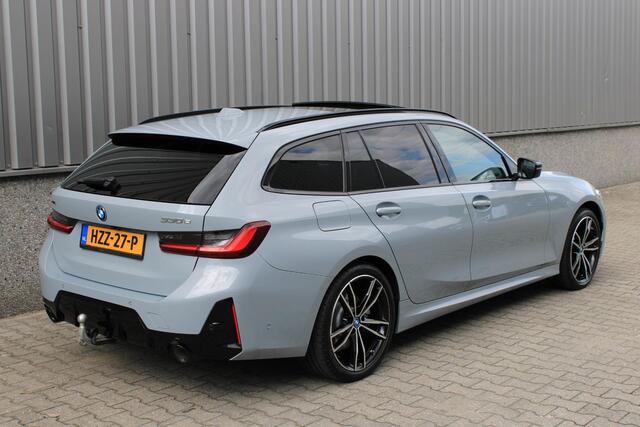 BMW 3-SERIE Touring 330e xDrive Touring M Sport Facelift | Pano | Trekhaak | Laser LED | Shadowline | Comfort Access | Sfeerverlichting | Brooklyn Grau | BTW