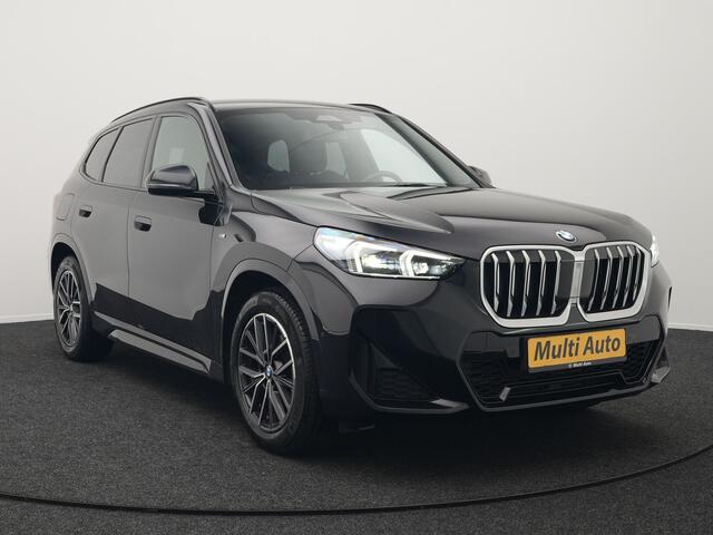 BMW X1 sDrive18i M-Sport Automaat 136pk Dealer O.H. | Trekhaak af Fabriek | Alcantara Sportstoelen Memory & Verwarmd | Camera | Cruise Control | Blis | Park Assist | Apple Carplay | Navigatie | Sfeerverlichting |