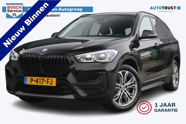 BMW X1 xDrive25e Business Edition Plus | Incl. 12 maanden garantie | Head-up display | Parkeersensoren | Verwarmde voorstoelen | Schuif/kantel dak | Climate control | Lichtmetalen velgen | Elektrische kofferklep | Cruise control | Bluetooth