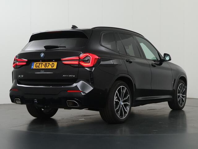 BMW X3 xDrive30e High Executive | M-Pakket | Trekhaak | Sportstoelen | Panoramadak | HUD | Harman/Kardon Audio | Adaptieve Cruise Control | Ele. verstelbare stoelen + geheugen | 360 Camera | DAB | Apple CarPlay/ Android Auto |