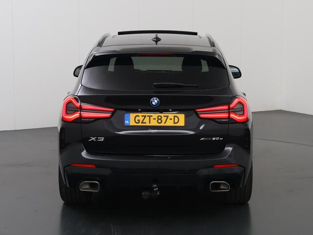 BMW X3 xDrive30e High Executive | M-Pakket | Trekhaak | Sportstoelen | Panoramadak | HUD | Harman/Kardon Audio | Adaptieve Cruise Control | Ele. verstelbare stoelen + geheugen | 360 Camera | DAB | Apple CarPlay/ Android Auto |