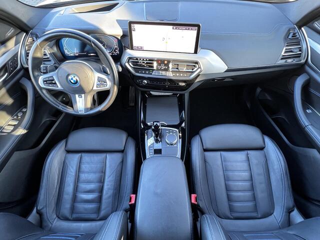 BMW X3 xDrive30e M-Sport Automaat / Zeer compleet / Elektrische trekhaak 2.000 kg / EAER 45 km / Head Up / Camera 360° / Adaptive Cruise / Elektr. panorma schuifdak / Elektr. klep en stoelen / M-Sport / Harman Kardon / 21" LM wielen 245/40R21 + 275/35R21/