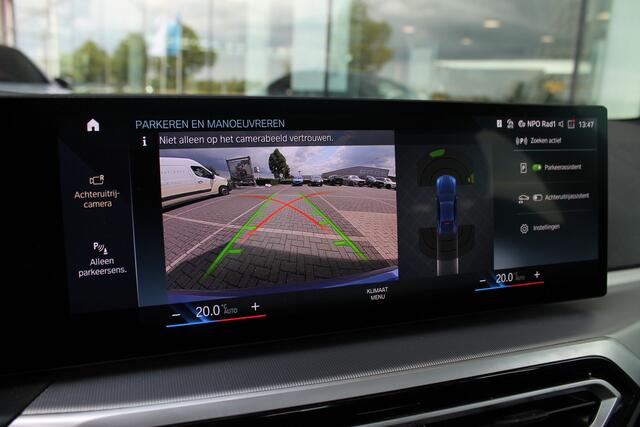 BMW i4 eDrive40 / Schuif-kanteldak / Achteruitrijcamera / Live Cockpit Plus / Parking Assistant / Stoelverwarming