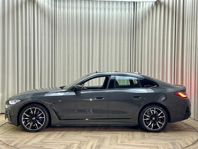 BMW i4 M50 84 kWh *M-Sport* Schuif/Kantel dak / Carbon / LASER LED / HUD / Harman Kardon / 360 Camera / Elek. Trekhaak / Org.NL!