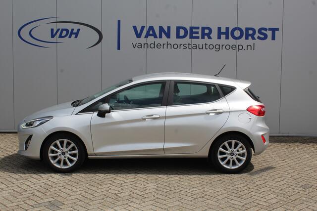 Ford FIESTA 1.0-100pk EcoBoost Titanium 5drs. Uiterst nette, luxe en zuinige Ford Fiesta. Voalautm. airco, Cruise control, Navigatie, LM wielen, Metallic lak, Parkeersensoren achter, Telefoonvoorb., Lane assist etc.